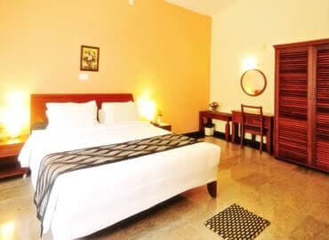 Bedroom 3 · Queen bed at Yercaud Bungalow Stay