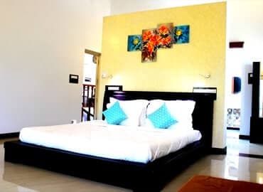 Bedroom 1 · King bed at Yercaud Bungalow Stay