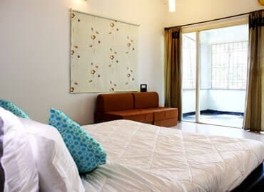 Bedroom 2 · Queen bed at Yercaud Bungalow Stay